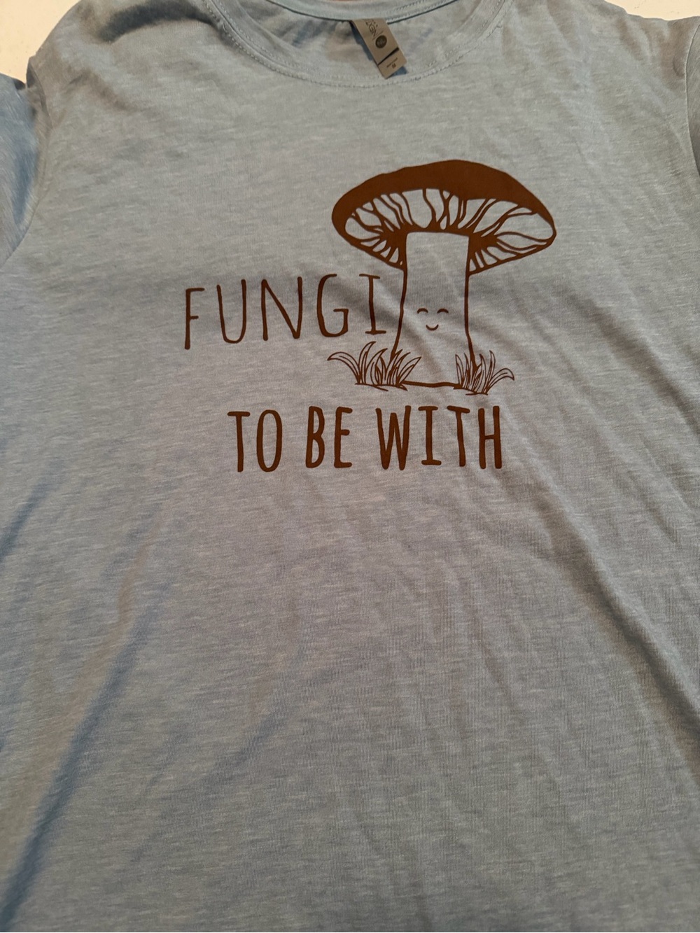 Next Level Apparel Light Blue Tee with Brown Mushroom Graphic